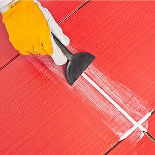 Worker Applies Grout Whit Rubber Trowel - Asian Paints Worker Applies Grout Whit Rubber Trowel - Asian Paints