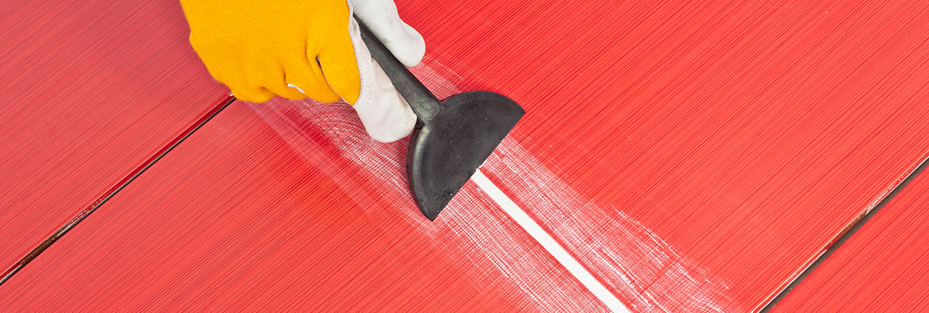 Worker Applies Grout Whit Rubber Trowel - Asian Paints