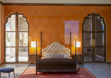 Warm Bedroom with Leaf Wallpaper