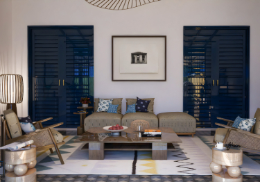 Beige Sofa with Geometric Rug