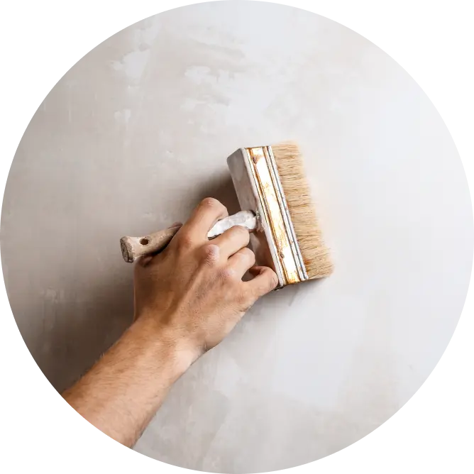 Application of interior primer using a painting brush. Asian Paints interior wall primers.