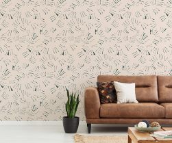 Pillows on brown leather settee in white living room interior with plant and copy space. Real photo