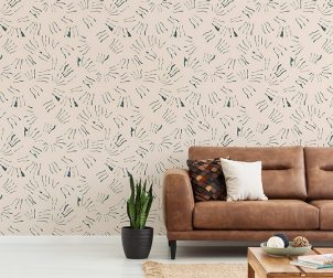 Pillows on brown leather settee in white living room interior with plant and copy space. Real photo