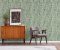 Vintage living room interior with retro furniture and poster on the cabinet, real photo with copy space on the white wall Vintage living room interior with retro furniture and poster on the cabinet, real photo with copy space on the white wall