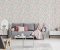 Pink blanket and cushions on grey settee in white flat interior with poster above cupboard. Real photo Pink blanket and cushions on grey settee in white flat interior with poster above cupboard. Real photo