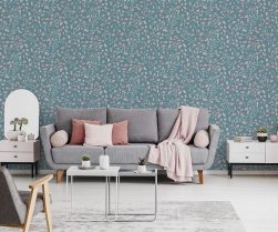 Pink blanket and cushions on grey settee in white flat interior with poster above cupboard. Real photo Pink blanket and cushions on grey settee in white flat interior with poster above cupboard. Real photo