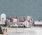 Pink blanket and cushions on grey settee in white flat interior with poster above cupboard. Real photo Pink blanket and cushions on grey settee in white flat interior with poster above cupboard. Real photo